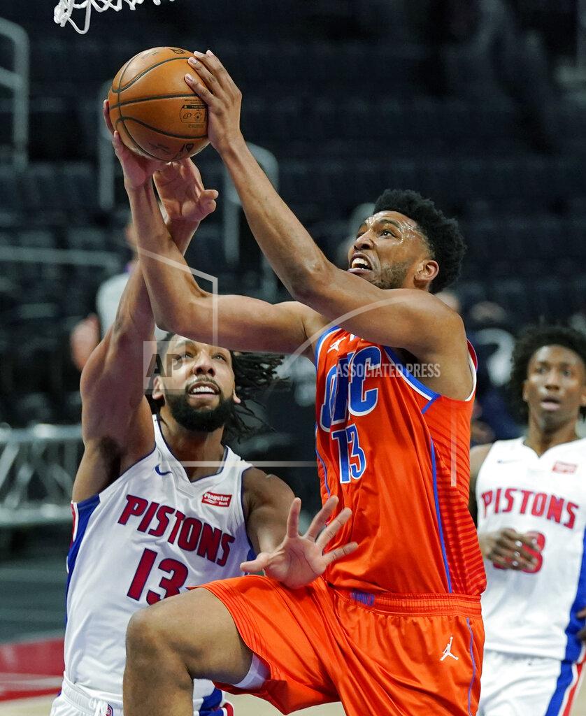 Carlos Osorio Oklahoma City Thunder center Tony Bradley (13) makes a layup as Detroit Pistons center Jahlil Okafor (13) defends during the first half of an NBA basketball game, Friday, April 16, 2021, in Detroit. (AP Photo/Carlos Osorio)