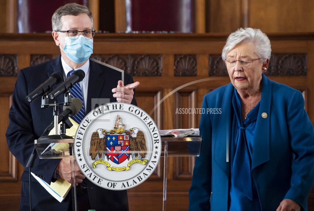 Gov. Kay Ivey and Alabama Health Officer Dr. Scott Harris answer questions during a news conference update on COVID-19 restrictions at the Alabama State Capitol in Montgomery, Ala., on Thursday, Nov. 5, 2020. (Jake Crandall/The Montgomery Advertiser via AP)