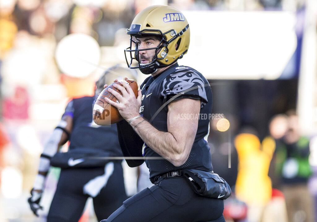 Daniel Lin James Madison quarterback Ben DiNucci (6) looks to throw during the first half of an NCAA college football game in Harrisonburg, Va, Saturday, Nov. 16, 2019. (Daniel Lin/Daily News-Record via AP)