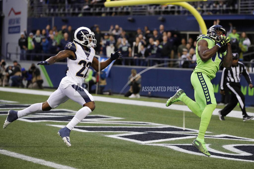 Stephen Brashear Seattle Seahawks wide receiver DK Metcalf, right, catches a pass for a touchdown ahead of Los Angeles Rams cornerback Marcus Peters (22) during the first half of an NFL football game Thursday, Oct. 3, 2019, in Seattle. (AP Photo/Stephen Brashear)