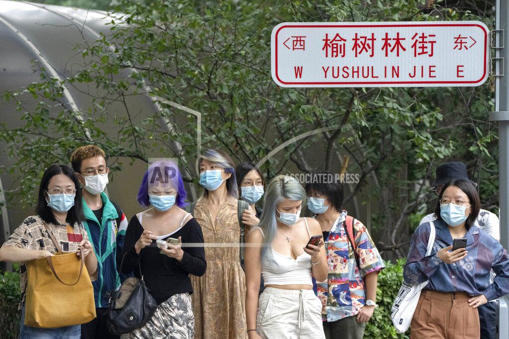 Mark Schiefelbein Supporters gather near a courthouse where Zhou Xiaoxuan, a former intern at China's state broadcaster CCTV, was to attend a court session in Beijing, Tuesday, Sept. 14, 2021. Zhou became the face of the country's MeToo movement after going public with accusations against a prominent CCTV host in 2018. Since then, even as the movement was shut down by authorities, Zhou has continued to speak out. (AP Photo/Mark Schiefelbein)