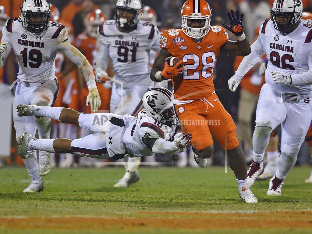Richard Shiro Clemson's Tavien Feaster (28) outruns the tackle attempt by South Carolina's R.J. Roderick during the second half of an NCAA college football game Saturday, Nov. 24, 2018, in Clemson, S.C. (AP Photo/Richard Shiro)
