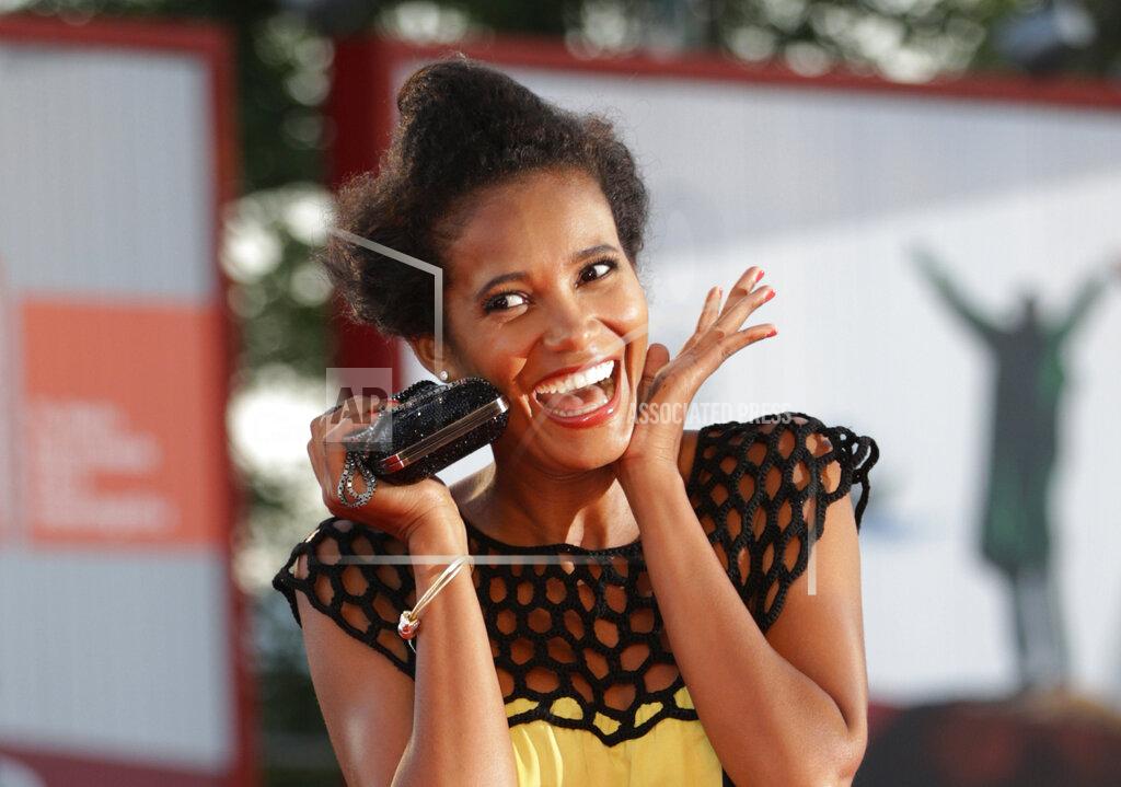 Andrew Medichini File - Model Denny Mendez poses for photographers on the red carpet for the film La Jalousie at the Venice Film Festival. The 77th Venice Film Festival will kick off on Wednesday, Sept. 2, 2020, but this year's edition will be unlike any others. Coronavirus restrictions will mean fewer Hollywood stars, no crowds interacting with actors and other virus safeguards will be deployed. (AP Photo/Andrew Medichini, File)