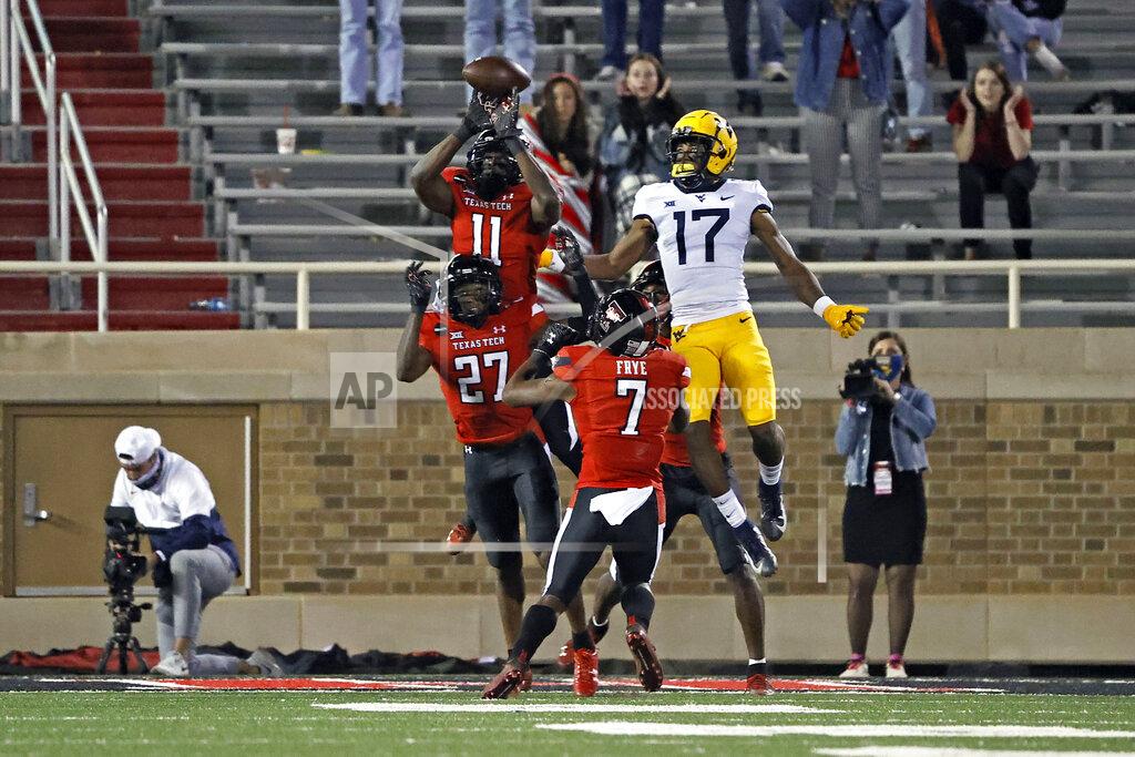 Brad Tollefson Texas Tech's Eric Monroe (11) breaks up the final play of the game during the second half of an NCAA college football game against West Virginia, Saturday, Oct. 24, 2020, in Lubbock, Texas. (AP Photo/Brad Tollefson)