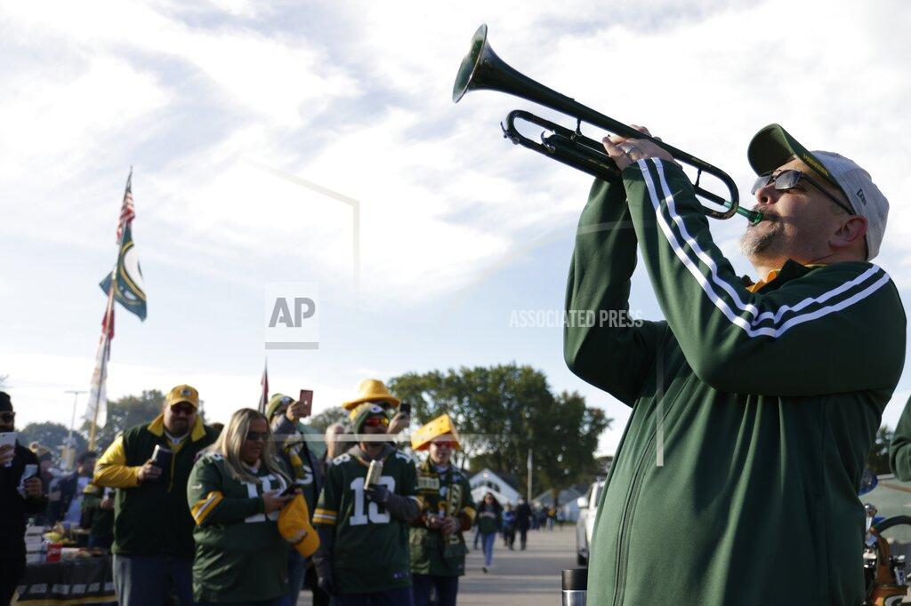 Matt Ludtke Fans outside Lambeau Field before an NFL football game between the Green Bay Packers and the Washington Football Team Sunday, Oct. 24, 2021, in Green Bay, Wis. (AP Photo/Matt Ludtke)
