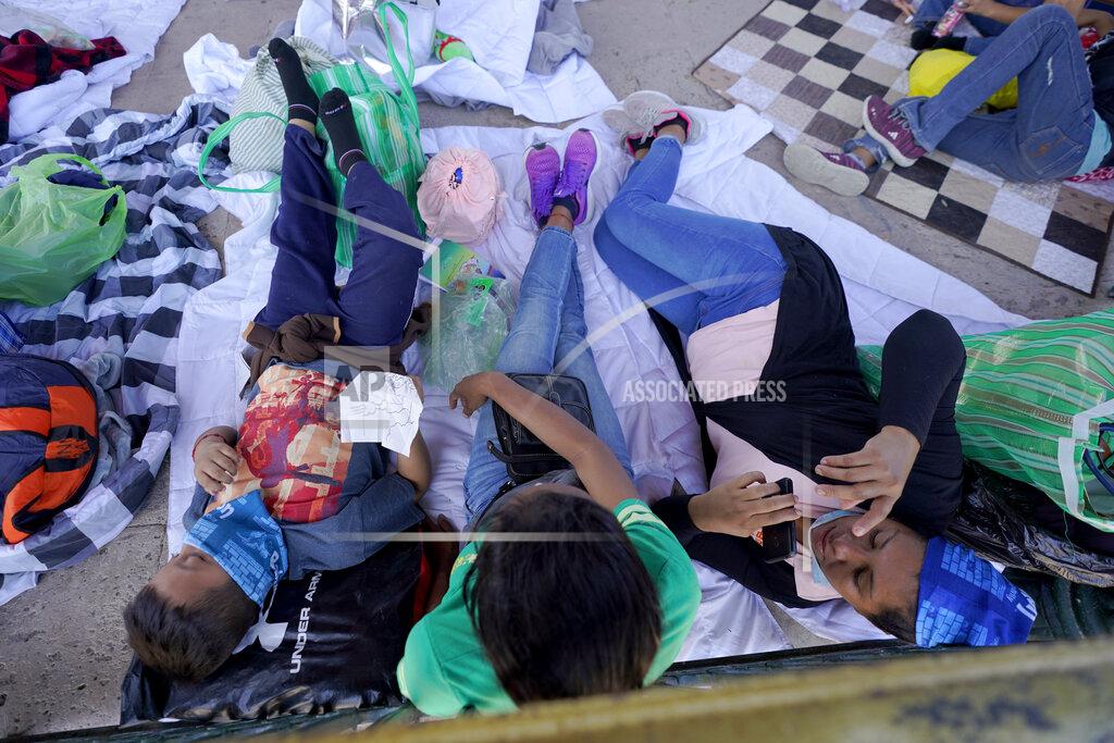 Julio Cortez Migrants rest in a gazebo at a park after a large group of deportees were pushed by Mexican authorities off an area they had been staying after their expulsion from the U.S., Saturday, March 20, 2021, in Reynosa, Mexico. A surge of migrants on the Southwest border has the Biden administration on the defensive. The head of Homeland Security acknowledged the severity of the problem Tuesday but insisted it's under control and said he won't revive a Trump-era practice of immediately expelling teens and children. An official says U.S. authorities encountered nearly double the number children traveling alone across the Mexican border in one day this week than on an average day last month. (AP Photo/Julio Cortez)