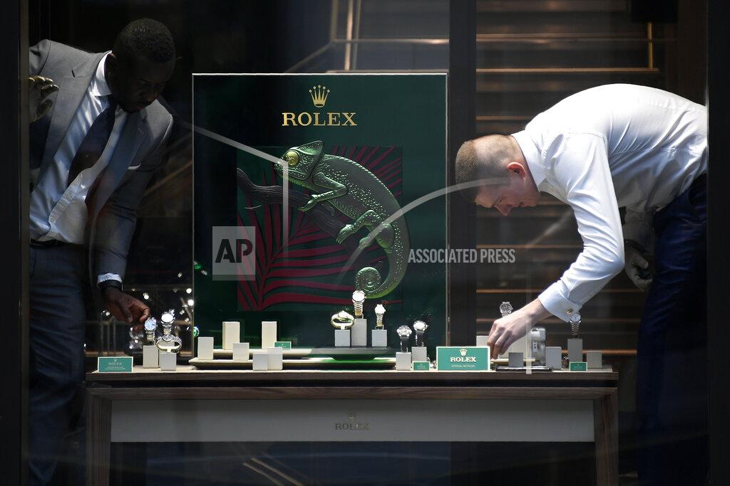 Alberto Pezzali Staf works on the display window of a shop in Oxford street in London, Monday, April 12, 2021. Millions of people in England will get their first chance in months for haircuts, casual shopping and restaurant meals on Monday, as the government takes the next step on its lockdown-lifting road map. (AP Photo/Alberto Pezzali)