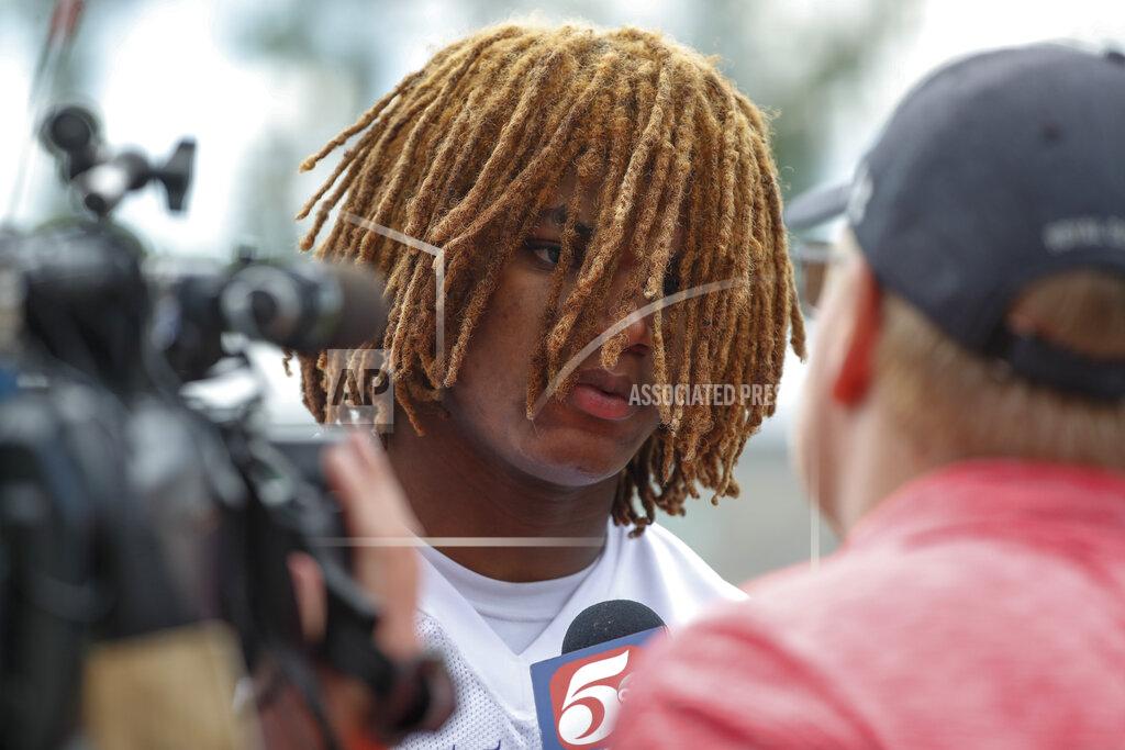 Bruce Kluckhohn FILE - Minnesota Vikings safety Lewis Cine speaks with the media after taking part in drills at the NFL football team's practice facility in Eagan, Minn., Wednesday, June 8, 2022. First-round draft pick Lewis Cine is expected to anchor Minnesota's secondary for many years to come, but rookies have to earn their way into the lineup. (AP Photo/Bruce Kluckhohn, File)