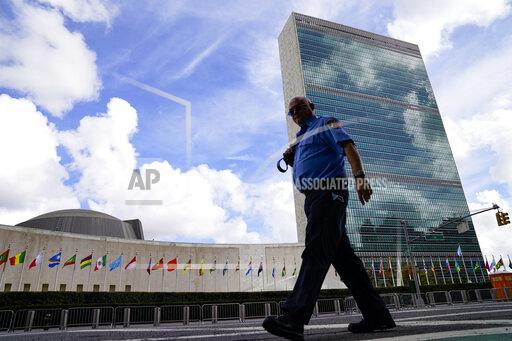 A member of the FDNY passes outside the United Nations headquarters, Tuesday, Sept. 21, 2021, during the 76th Session of the U.N. General Assembly in New York. (AP Photo/John Minchillo, Pool)