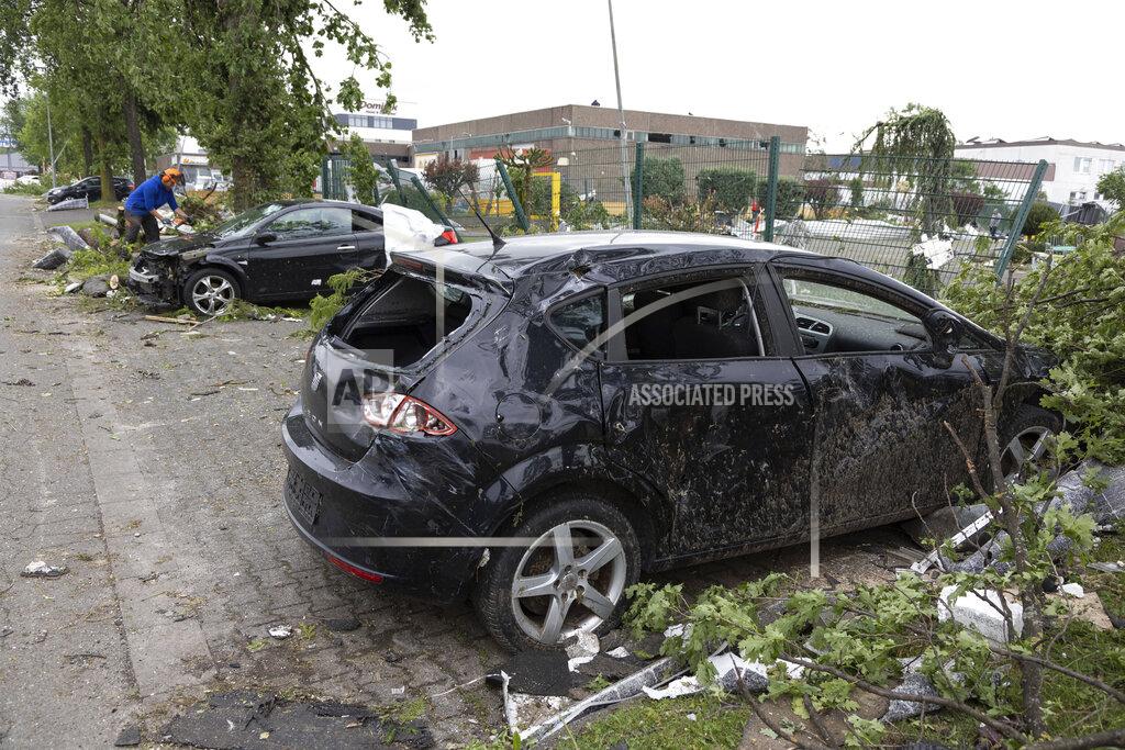Friso Gentsch Destroyed cars lie by a road following a tornado that hit thea area on Friday, in Paderborn and Lippstadt, Germany, Saturday, May 21, 2022. (Friso Gentsch/dpa via AP)