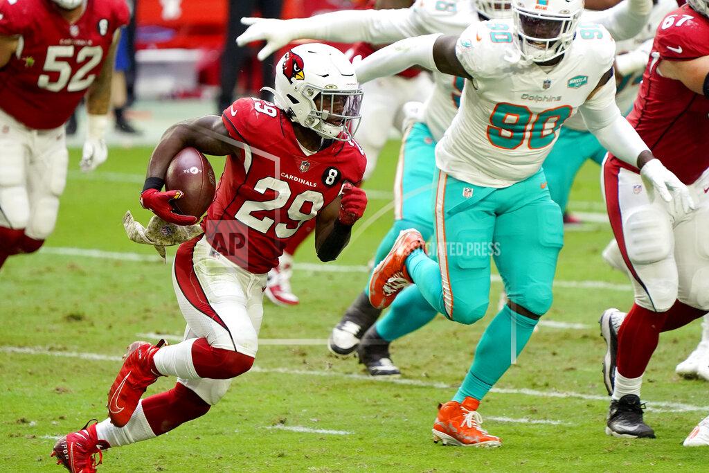 Rick Scuteri Arizona Cardinals running back Chase Edmonds (29) runs the ball as Miami Dolphins defensive end Shaq Lawson (90) pursues during the first half of an NFL football game, Sunday, Nov. 8, 2020, in Glendale, Ariz. (AP Photo/Rick Scuteri)