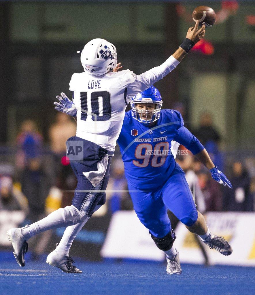 Darin Oswald Boise State nose tackle Sonatane Lui (98) puts pressure on Utah State quarterback Jordan Love (10) during the second quarter of an NCAA college football game Saturday, Nov. 24, 2018, in Boise, Idaho. (Darin Oswald/Idaho Statesman via AP)
