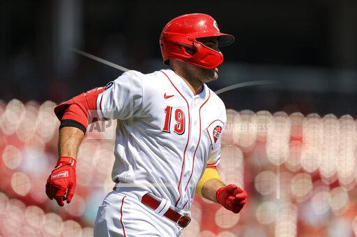 Cincinnati Reds' Joey Votto runs the bases after hitting a two-run home run during the first inning of a baseball game against the Pittsburgh Pirates in Cincinnati, Monday, Sept. 27, 2021. (AP Photo/Aaron Doster)