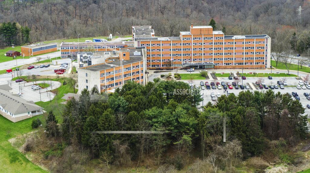 FILE - In this March 30, 2020, file photo, Brighton Rehabilitation and Wellness Center photographed in Beaver, Pa. State health officials reported Wednesday, April 29, that COVID-19 has killed hundreds more nursing home residents than was previously known. One of the worst outbreaks is at the Beaver County center. (Andrew Rush/Pittsburgh Post-Gazette via AP, File)