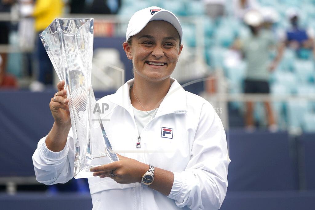 Lynne Sladky Ashleigh Barty of Australia poses with the trophy after winning her match against Bianca Andreescu of Canada during the finals at the Miami Open tennis tournament, Saturday, April 3, 2021, in Miami Gardens, Fla. Barty won 6-3, 4-0, as Andreescu retired due to injury. (AP Photo/Lynne Sladky)