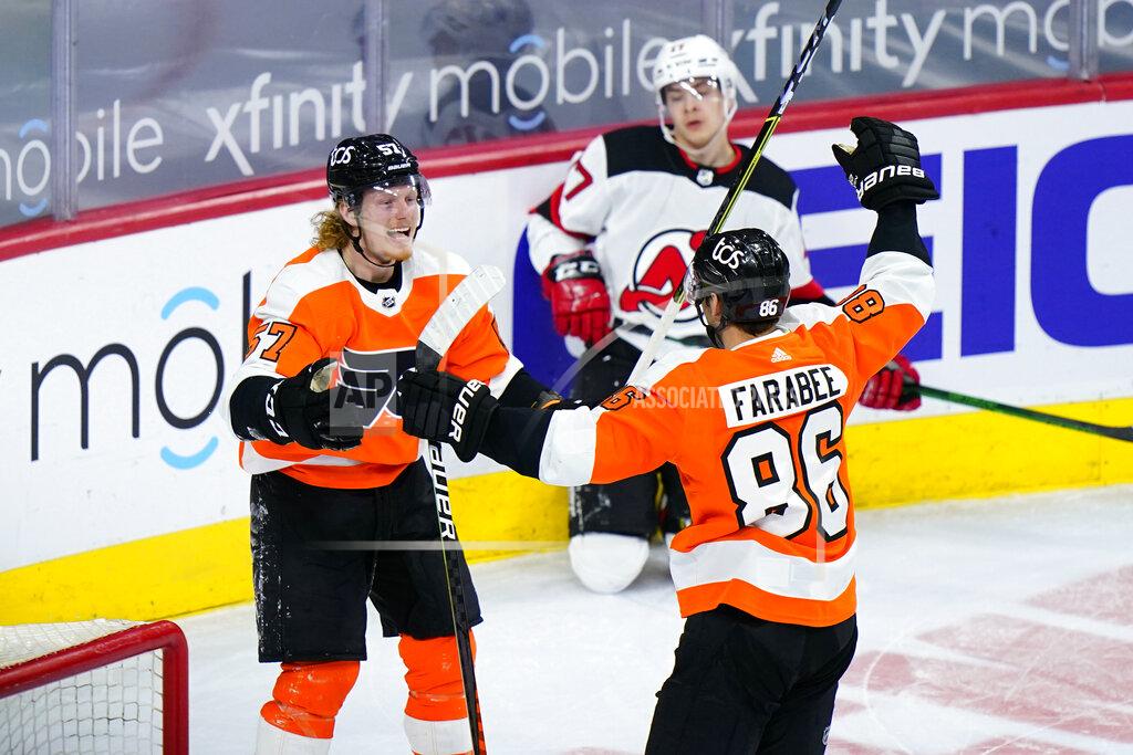 Matt Slocum Philadelphia Flyers' Joel Farabee (86) and Wade Allison (57) celebrate past New Jersey Devils' Yegor Sharangovich (17) after Farabee's goal during the third period of an NHL hockey game, Monday, May 10, 2021, in Philadelphia. (AP Photo/Matt Slocum)