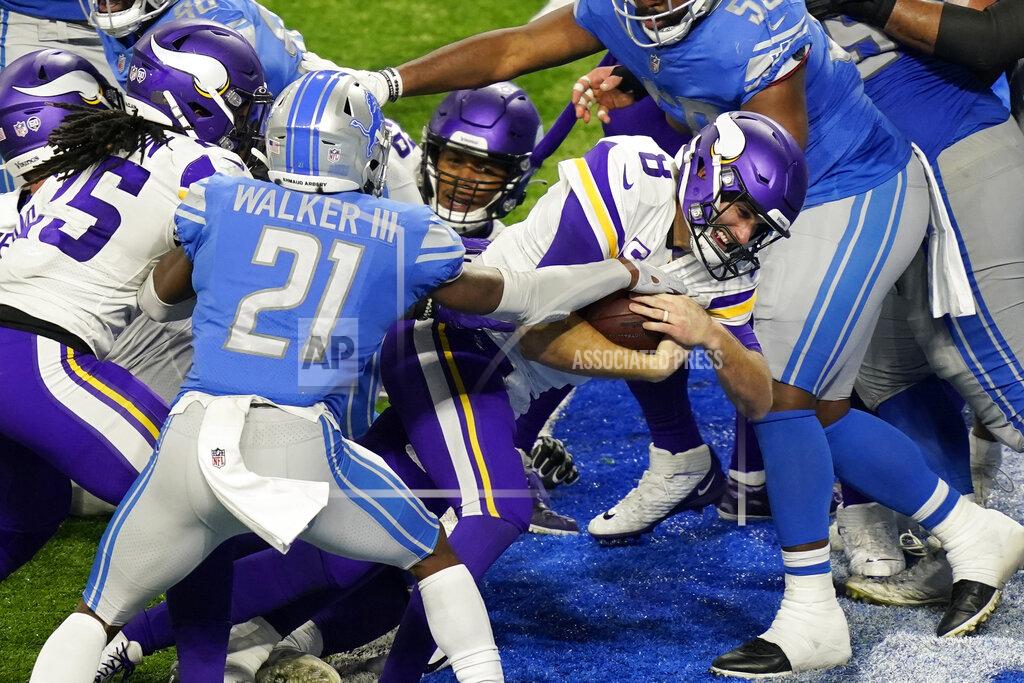 Carlos Osorio Minnesota Vikings quarterback Kirk Cousins (8) crosses the goal line for a 1-yard touchdown during the second half of an NFL football game against the Detroit Lions, Sunday, Jan. 3, 2021, in Detroit. (AP Photo/Carlos Osorio)