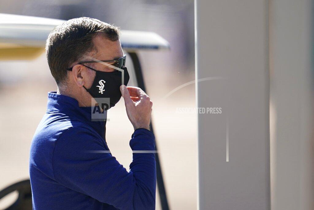 Ross D. Franklin Chicago White Sox general manager Rick Hahn adjusts his face covering as he watches players during baseball spring training Wednesday, Feb. 24, 2021, in Phoenix. (AP Photo/Ross D. Franklin)