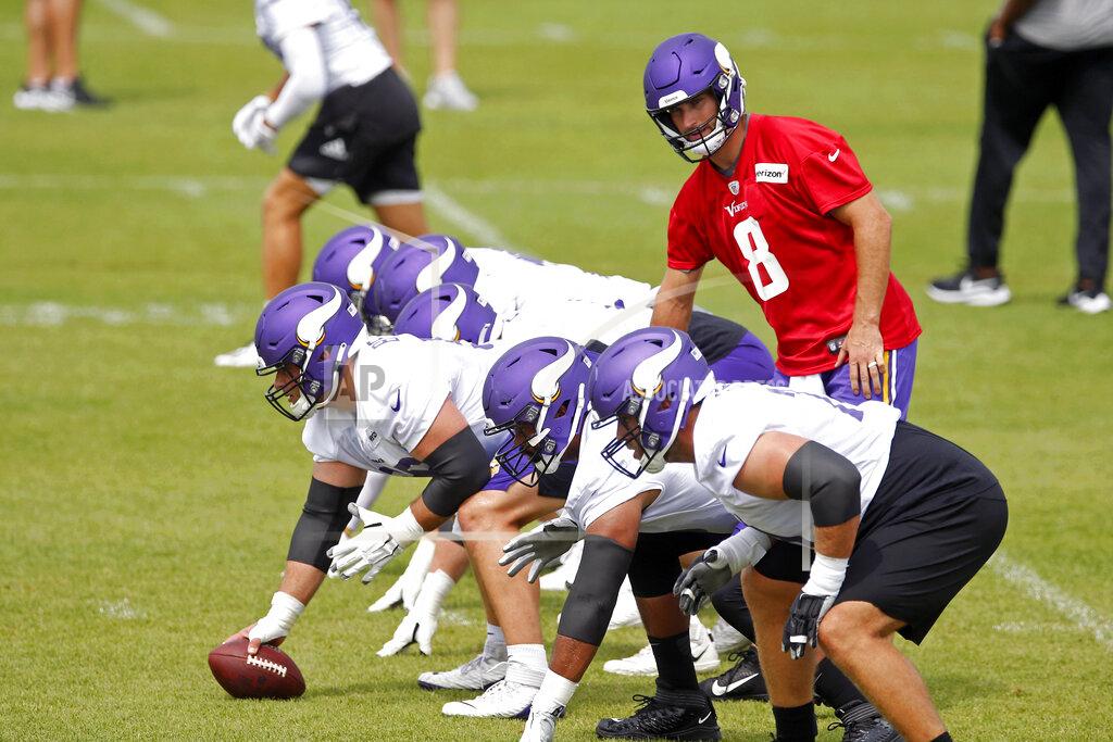 Minnesota Vikings quarterback Kirk Cousins (8) prepares for a pass play during the NFL football team's practice Friday, Aug. 14, 2020, in Eagan, Minn. (AP Photo/Jim Mone)