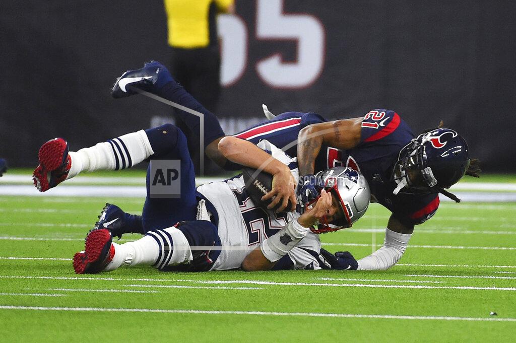Eric Christian Smith New England Patriots quarterback Tom Brady (12) is sacked by Houston Texans cornerback Bradley Roby (21) during the second half of an NFL football game Sunday, Dec. 1, 2019, in Houston. (AP Photo/Eric Christian Smith)