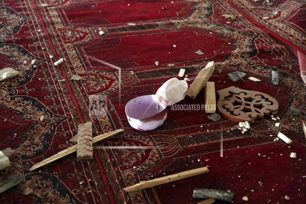 Rahmat Gul A blood-stained cap is seen inside a mosque after a bomb explosion in Shakar Dara district of Kabul, Afghanistan, Friday, May 14, 2021. A bomb ripped through a mosque in northern Kabul during Friday prayers killing 12 worshippers, Afghan police said. (AP Photo/Rahmat Gul)