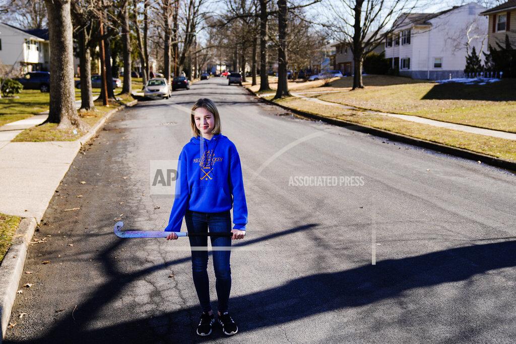 Matt Rourke Rebekah Bruesehoff, 14, poses for a portrait in New Jersey, Friday, Feb. 26, 2021. The transgender teenager competes on her middle school field hockey team and hopes to keep playing in high school. "It’s all been positive,” she said. “The coaches have been really helpful.” (AP Photo/Matt Rourke)