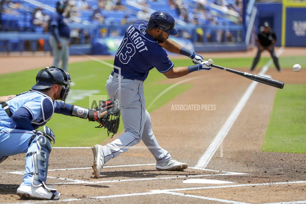 Mike Carlson Tampa Bay Rays' Manuel Margot (13) hits an RBI-single to score Randy Arozarena in front of Toronto Blue Jays catcher Danny Jansen, left, during the first inning of a baseball game Sunday, May 23, 2021, in Dunedin, Fla. (AP Photo/Mike Carlson)