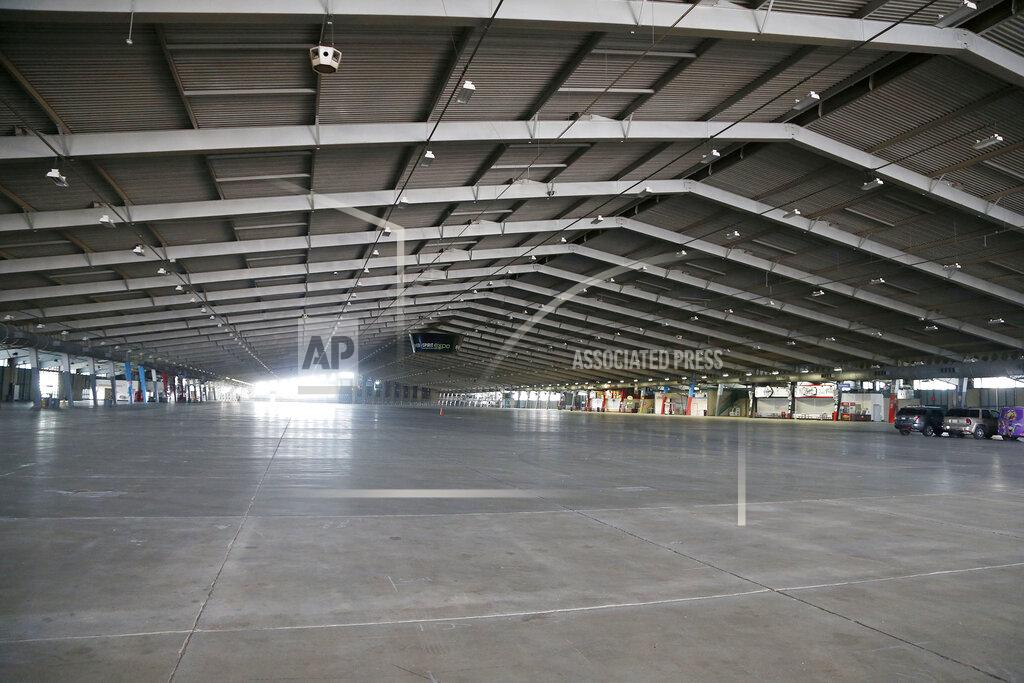 Stephen Pingry In this Thursday, April 2, 2020, photo, Tulsa River Spirit Expo Center is mostly empty at the Tulsa Fairgrounds in Tulsa, Okla. (Stephen Pingry/Tulsa World via AP)