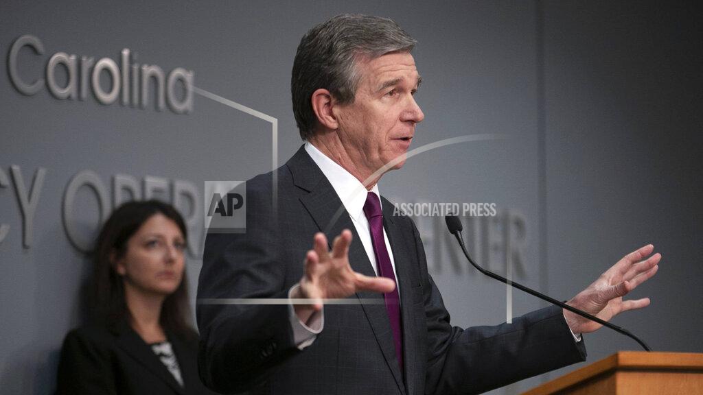 Robert Willett North Carolina Governor Roy Cooper speaks during a press briefing on the COVID-19 virus on Tuesday, April 21, 2020 at the Emergency Operations Center in Raleigh, N.C. (Robert Willett/The News & Observer via AP)