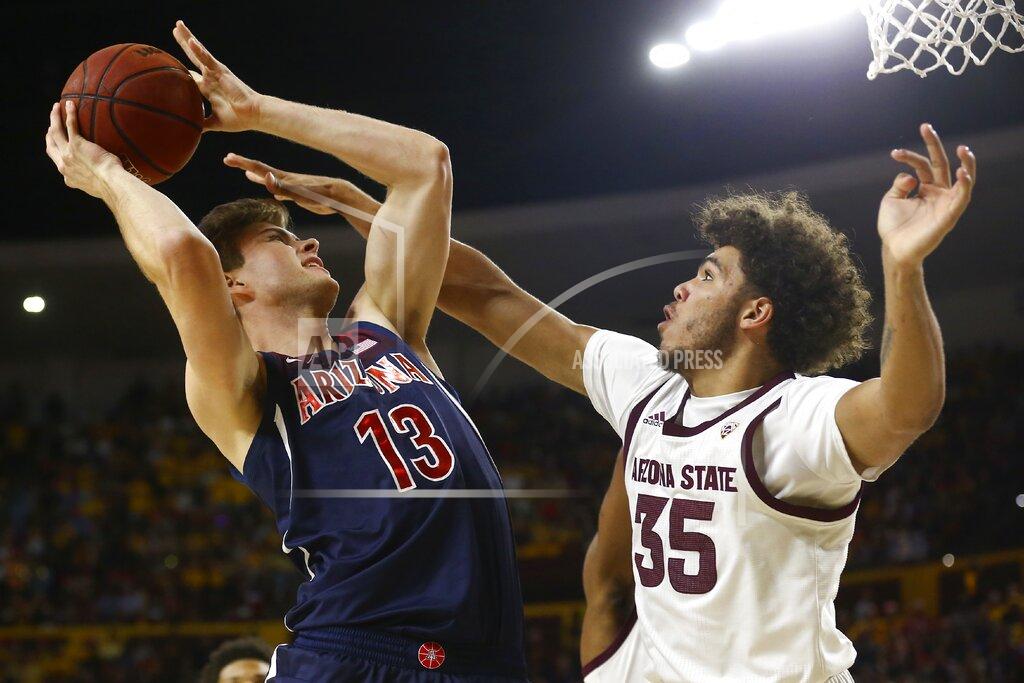 Ross D. Franklin Arizona forward Stone Gettings (13) shoots over Arizona State forward Taeshon Cherry (35) during the first half of an NCAA college basketball game Saturday, Jan. 25, 2020, in Tempe, Ariz. (AP Photo/Ross D. Franklin)