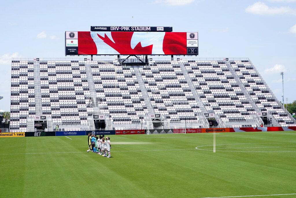 Lynne Sladky CF Montreal and Toronto FC players stand for the national anthem in a nearly empty DRV PNK Stadium during the first half of an MLS soccer match, Saturday, April 17, 2021, in Fort Lauderdale, Fla. CF Montreal is playing the first part of their season in Inter Miami's stadium due to the coronavirus pandemic. (AP Photo/Lynne Sladky)