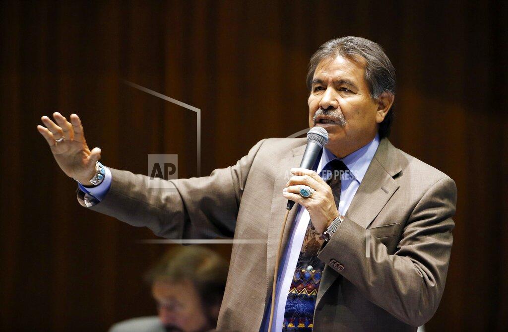 FILE - In this March 4, 2015, file photo, then-Rep. Albert Hale, D-St. Michaels, talks at the Arizona Capitol in Phoenix. Hale, who served as the second president of the Navajo Nation in the 1990s, died Tuesday, Feb. 2, 2021. A cause of death and an exact age for Hale was not immediately available. But tribal officials said Hale was in his early 70s and was battling COVID-19 when the Navajo Nation Council heard of his condition last Friday. (AP Photo/Ross D. Franklin, File)