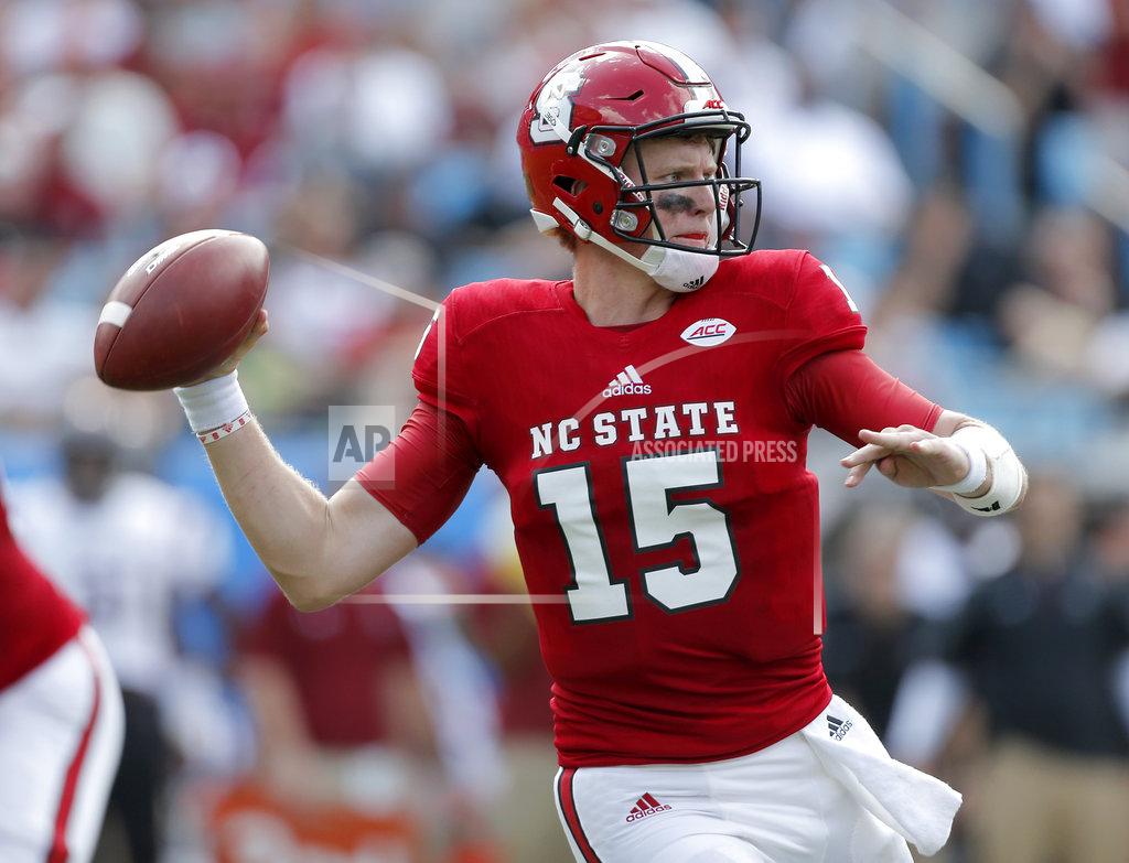 Bob Leverone FILE - In this Sept. 2, 2017, file photo, North Carolina State's Ryan Finley (15) looks for an open receiver against South Carolina during the first half of an NCAA college football game in Charlotte, N.C. Coach Dino Babers has led Syracuse to a surprising 4-2 record midway through the season, while Clemson and North Carolina State, led by quarterback Ryan Finley, are undefeated entering a big showdown this week. All drew attention in midseason voting by AP writers covering the 14 ACC teams. (AP Photo/Bob Leverone, File)