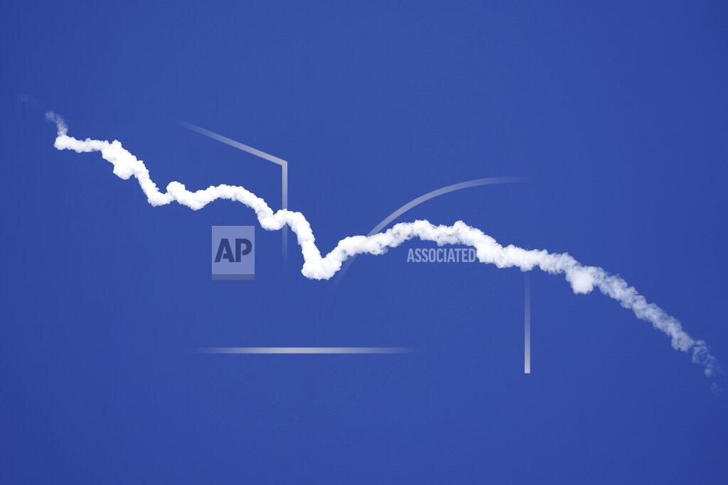 Lm Otero Blue Origin's New Shepard rocket leaves a smoke trail after lifting off from its spaceport near Van Horn, Texas, Wednesday, Oct. 13, 2021. (AP Photo/LM Otero)