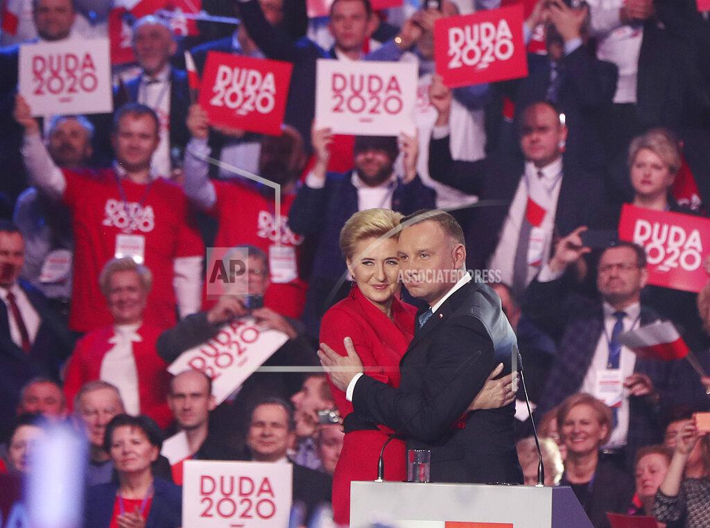 Czarek Sokolowski File - In this file photo taken Feb. 15, 2020, in Warsaw, Poland are seen Poland's President Andrzej Duda, right, with wife Agata Kornhauser-Duda, campaigning for Duda's re-election in May 10 national vote. The Polish government’s determination to move forward with the May 10, presidential election during the coronavirus pandemic by making it an all-postal vote, though critics say the plan threatens public health and democracy in Poland. (AP Photo/Czarek Sokolowski)