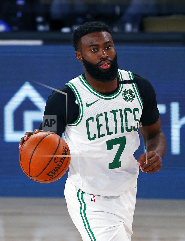 Mike Ehrmann Boston Celtics' Jaylen Brown handles the ball during the second half of an NBA basketball game against the Memphis Grizzlies Tuesday, Aug. 11, 2020, in Lake Buena Vista, Fla. (AP Photo/Mike Ehrmann, Pool)