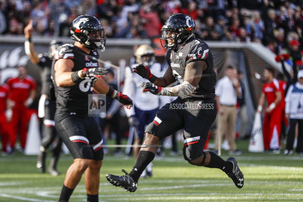 John Minchillo Cincinnati running back Michael Warren II (3) celebrates after scoring a touchdown in the first half of an NCAA college football game against Navy, Saturday, Nov. 3, 2018, in Cincinnati. (AP Photo/John Minchillo)