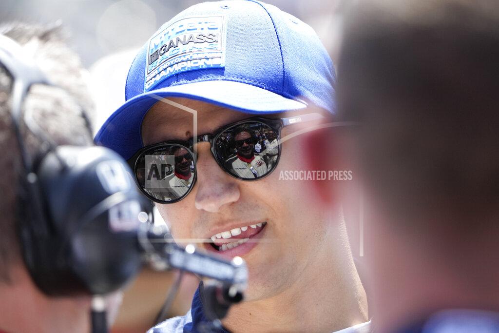 Aj Mast Alex Palou, of Spain, speaks with his crew before the Indianapolis 500 auto race at Indianapolis Motor Speedway in Indianapolis, Sunday, May 29, 2022. (AP Photo/AJ Mast)
