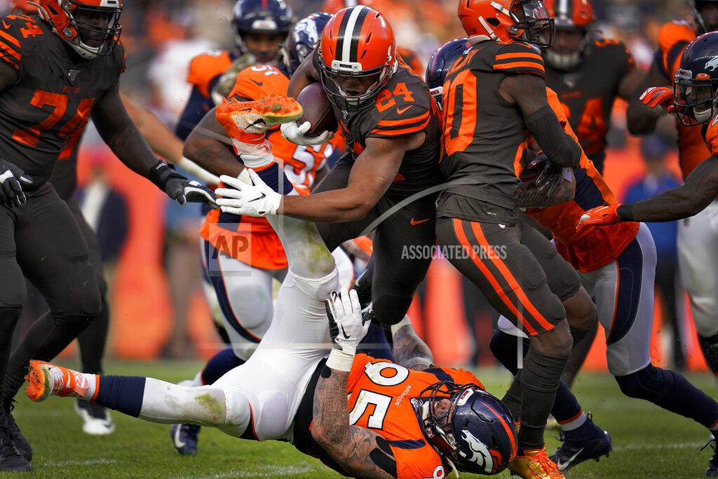 Jack Dempsey Cleveland Browns running back Nick Chubb (24) runs over Denver Broncos defensive end Derek Wolfe (95) during the first half of NFL football game, Sunday, Nov. 3, 2019, in Denver. (AP Photo/Jack Dempsey)