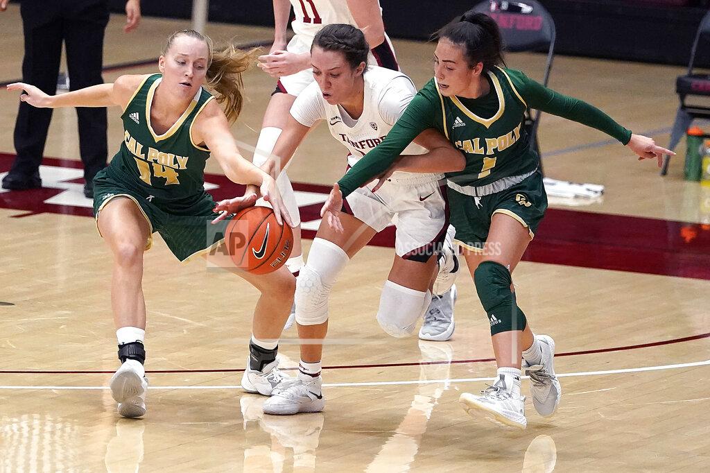 Tony Avelar Stanford guard Lacie Hull, center, chases after a loose ball against Cal Poly forward Hannah Scanlan (14) and Abbey Ellis (1) during the first half of an NCAA college basketball game in Stanford, Calif., Wednesday, Nov. 25, 2020. (AP Photo/Tony Avelar)