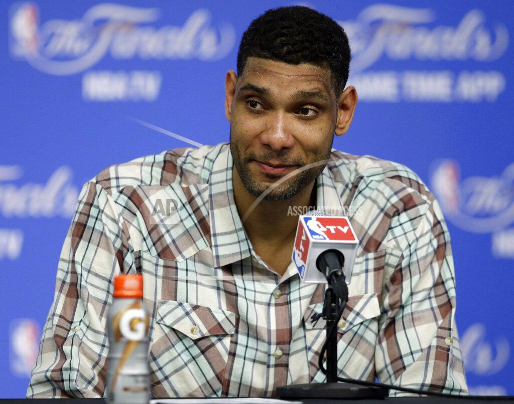 Tony Gutierrez FILE - In this June 5, 2014 file photo, San Antonio Spurs forward Tim Duncan listens to a question during a news conference in San Antonio. Duncan, fellow NBA greats Kobe Bryant and Kevin Garnett headlined a nine-person group announced Saturday, April 4, 2020, as this year’s class of enshrinees into the Naismith Memorial Basketball Hall of Fame. They all got into the Hall in their first year of eligibility, as did WNBA great Tamika Catchings. Two-time NBA champion coach Rudy Tomjanovich, longtime Baylor women’s coach Kim Mulkey, 1,000-game winner Barbara Stevens of Bentley and three-time Final Four coach Eddie Sutton were selected. So was former FIBA Secretary General Patrick Baumann. (AP Photo/Tony Gutierrez, File)