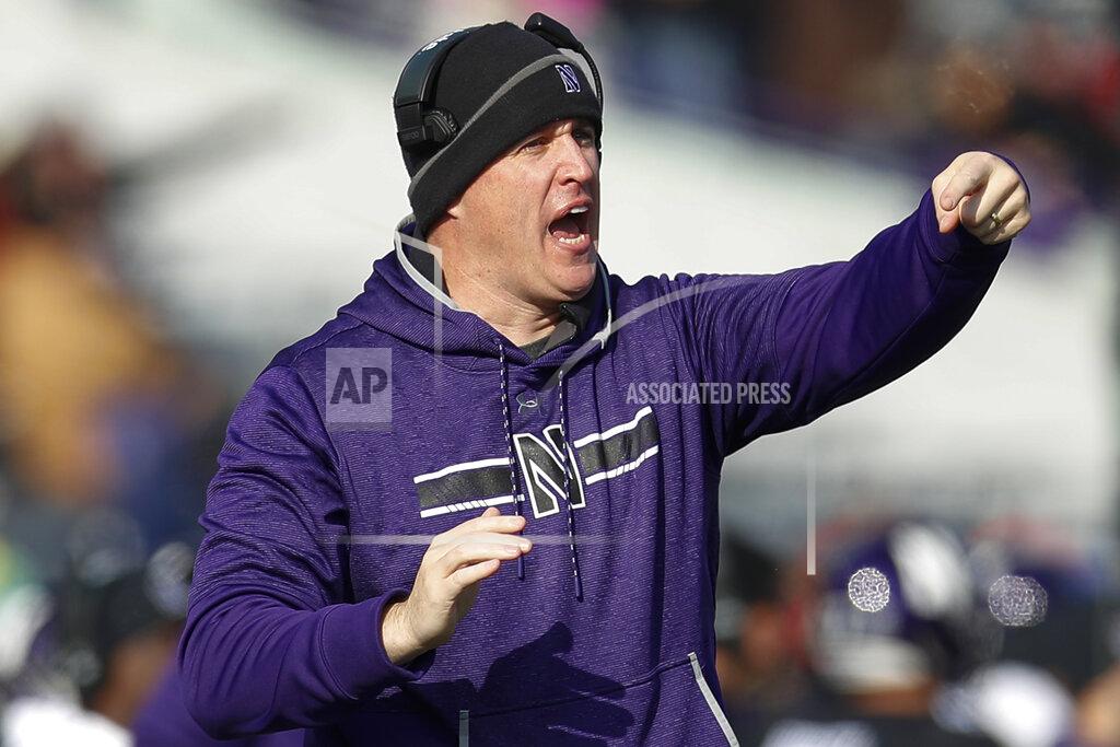 Jim Young Northwestern coach Pat Fitzgerald calls out a play during the first half of an NCAA college football game against Massachusetts, Saturday, Nov. 16, 2019, in Evanston, Ill. (AP Photo/Jim Young)