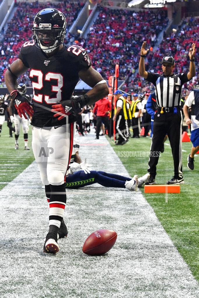 John Amis Atlanta Falcons running back Brian Hill (23) celebrates his touchdown against the Seattle Seahawks during the second half of an NFL football game, Sunday, Oct. 27, 2019, in Atlanta. (AP Photo/John Amis)
