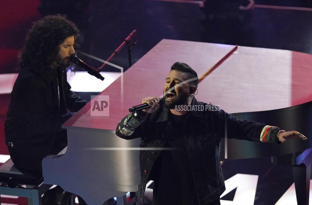 Chris Pizzello Dan Smyers, left, and Shay Mooney, of Dan + Shay, perform "I Should Probably Go to Bed" at the American Music Awards on Sunday, Nov. 22, 2020, at the Microsoft Theater in Los Angeles. (AP Photo/Chris Pizzello)