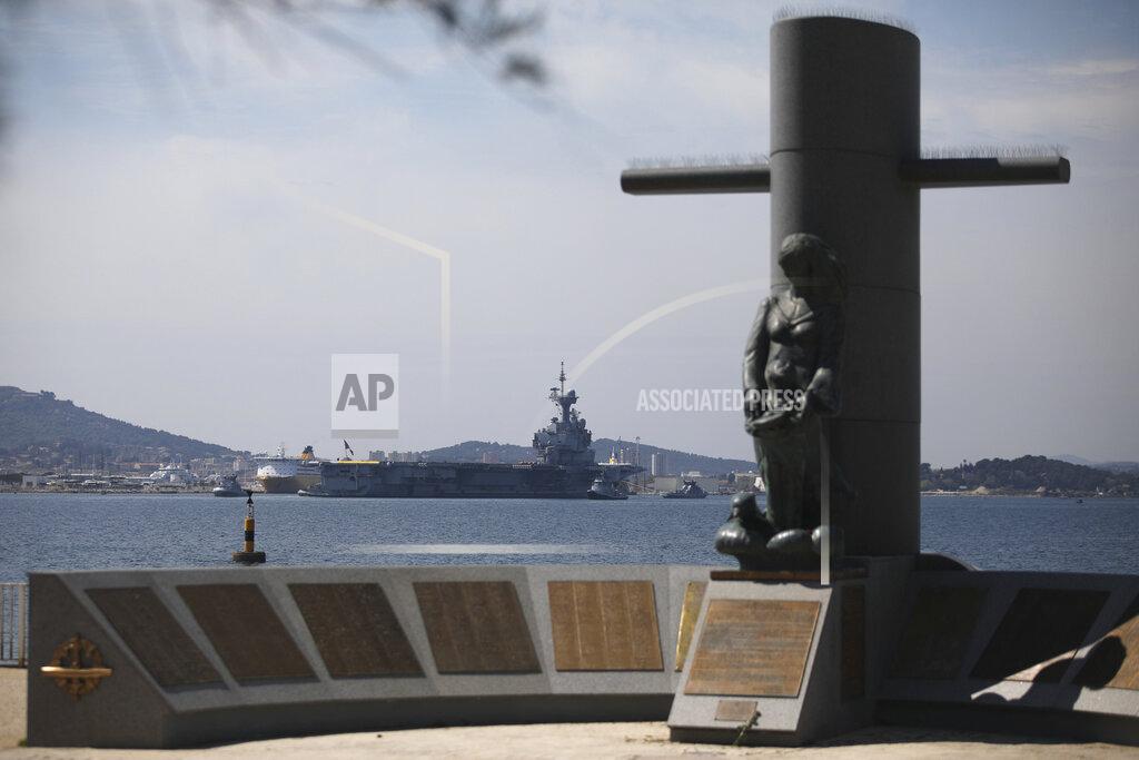 Daniel Cole The French aircraft carrier Charles de Gaulle docks at the military base of Toulon, southern France, Sunday April 12, 2020. The Defense Ministry said in a statement that around 40 sailors showed symptoms compatible with COVID-19, the disease the coronavirus causes. The new coronavirus causes mild or moderate symptoms for most people, but for some, especially older adults and people with existing health problems, it can cause more severe illness or death. (AP Photo/Daniel Cole)