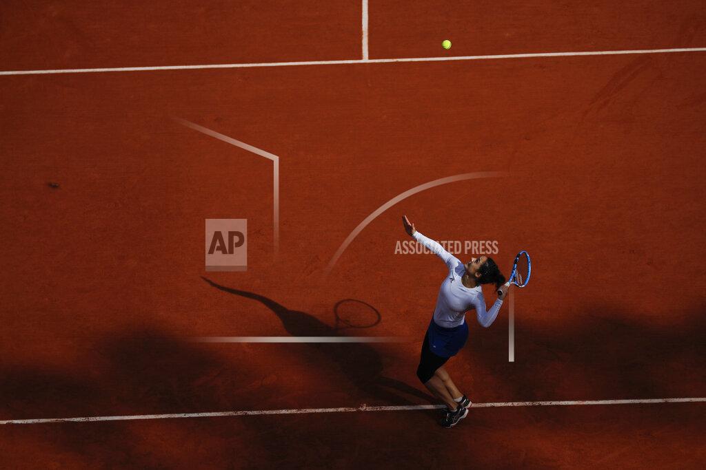 Christophe Ena Italy's Martina Trevisan serves against Netherlands' Kiki Bertens in the fourth round match of the French Open tennis tournament at the Roland Garros stadium in Paris, France, Sunday, Oct. 4, 2020. (AP Photo/Christophe Ena)