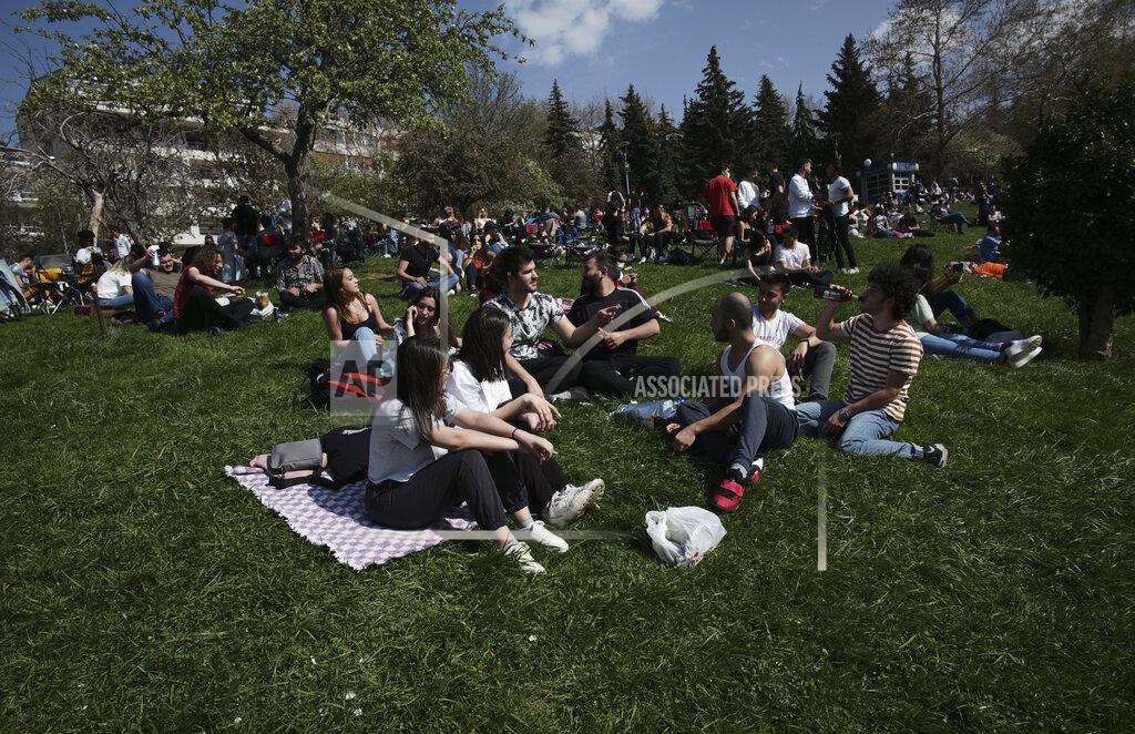Burhan Ozbilici People sit in a park in Ankara, Turkey, Thursday, April 29, 2021, just hours before the start of a three-week full lockdown. People stocked up on groceries, shoppers filled markets and many left cities for their hometowns or the southern coast as Turkey's strictest COVID-19 lockdown yet comes into effect later on Thursday. President Recep Tayyip Erdogan imposed a "full lockdown" from Thursday evening until May 17 amid soaring COVID-19 infections and deaths. Turkey now ranks among the world's worst-hit countries. (AP Photo/Burhan Ozbilici)