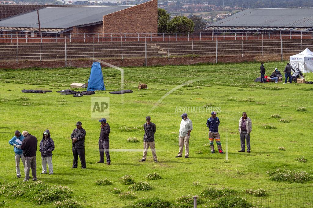 Jerome Delay Residents from the Alexandra township in Johannesburg gather in a stadium to be tested for COVID-19 Monday, April 26, 2020. South Africa will began a phased easing of its strict lockdown measures on May 1, although its confirmed cases of coronavirus continue to increase. (AP Photo/Jerome Delay)