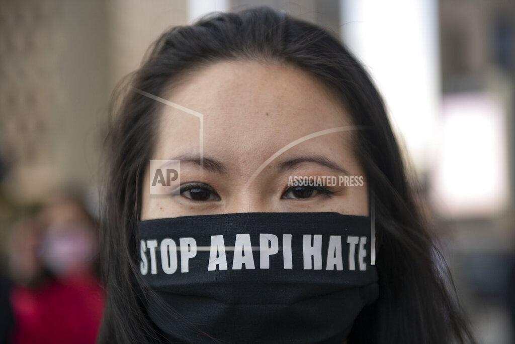 Nicole Hester FILE - This March 27, 2021, file photo shows, Martha Bryan standing at Spirit Plaza after marching during the second consecutive weekend of Stop Asian Hate Protest in Detroit. A national coalition of civil rights groups will release on Wednesday, July 28, 2021, a comprehensive, state-by-state review of hate crime laws in the United States. Members of the coalition say the report sets the stage for bolstering the efficacy of current law and addresses racial disparities in how the laws are enforced. (Nicole Hester/Ann Arbor News via AP, File)