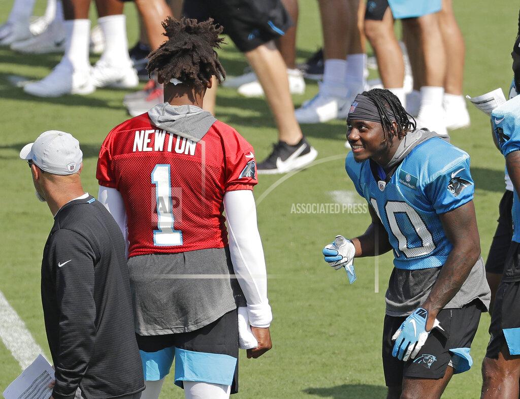 Chuck Burton Carolina Panthers' Curtis Samuel (10) jokes with Cam Newton (1) during practice at the NFL football team's training camp in Spartanburg, N.C., Friday, July 26, 2019. (AP Photo/Chuck Burton)